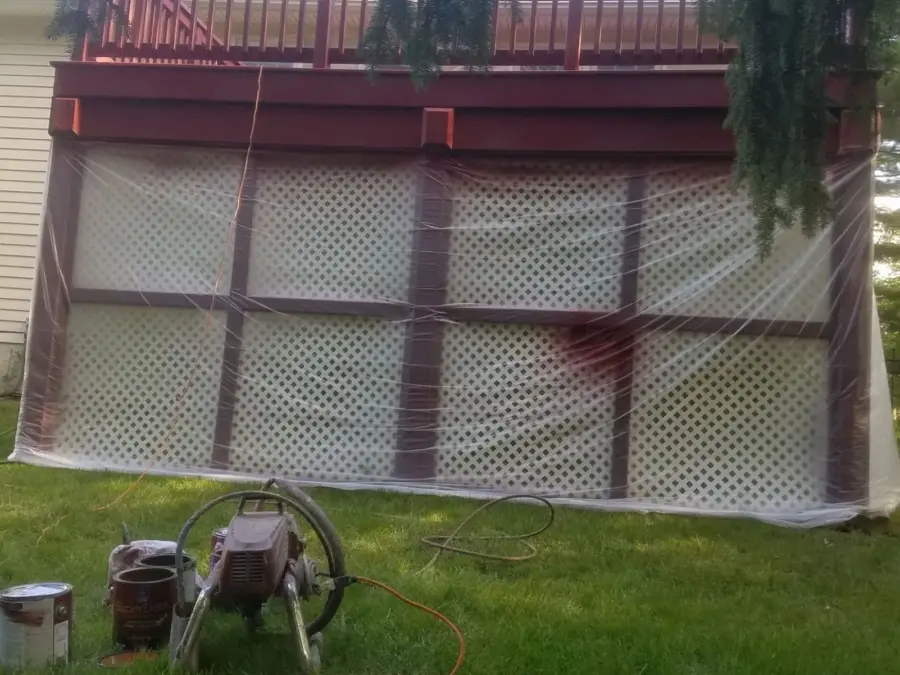 A cannon is sitting in the grass in front of a house