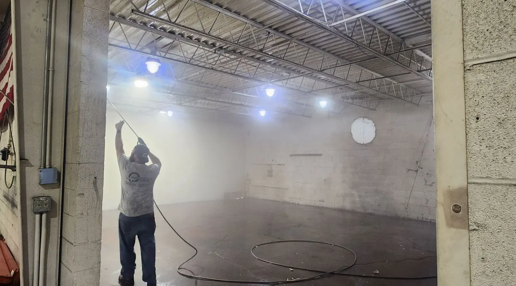 JMU crew power washing the interior of an Akron commercial building