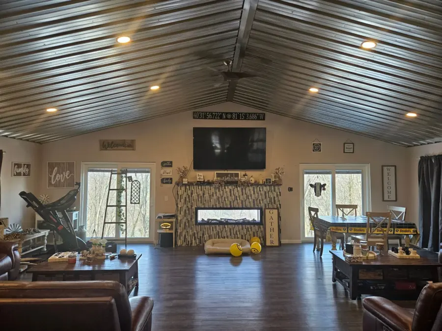 A living room filled with furniture and a flat screen tv.